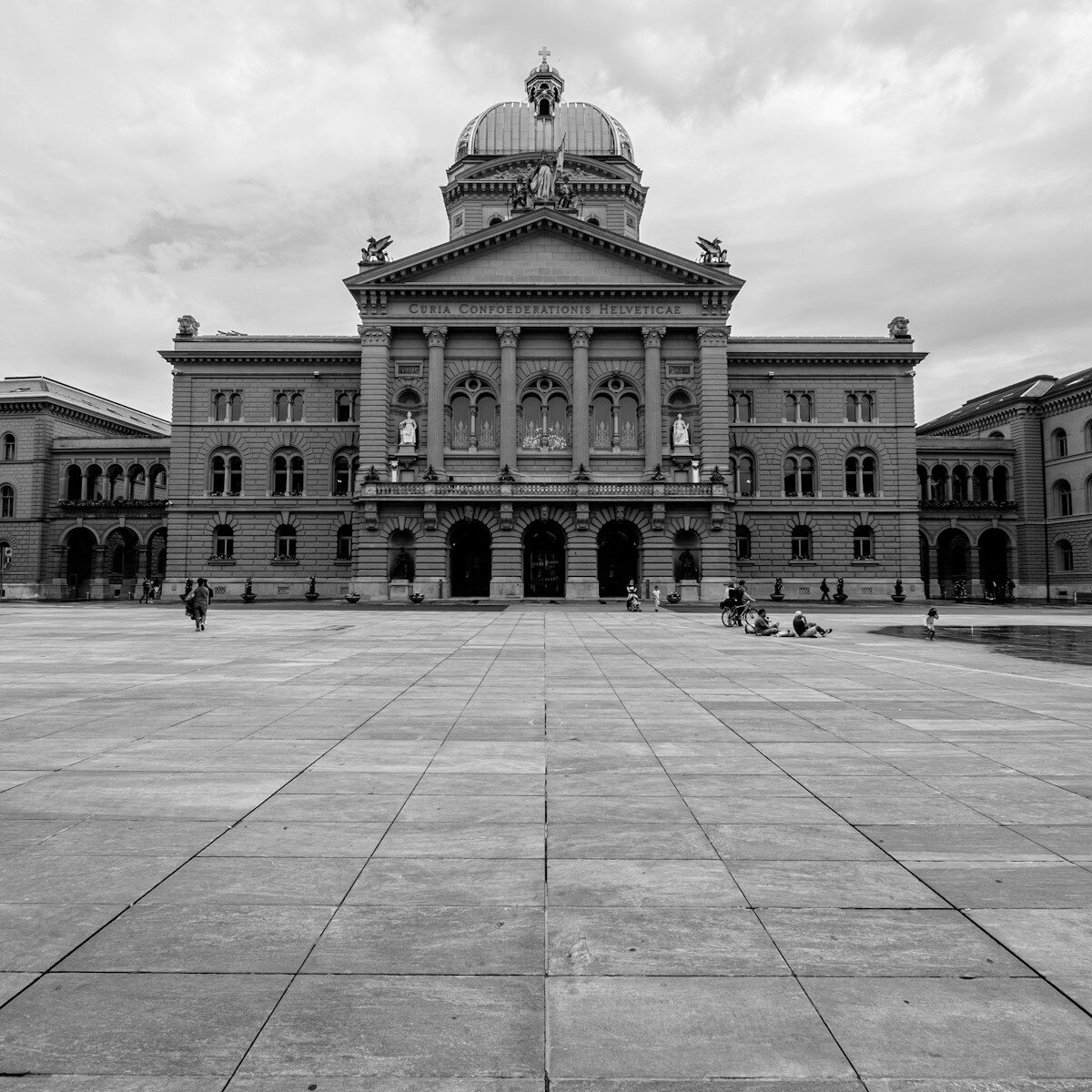 Photo by Jonas Zürcher a black and white photo of a large building